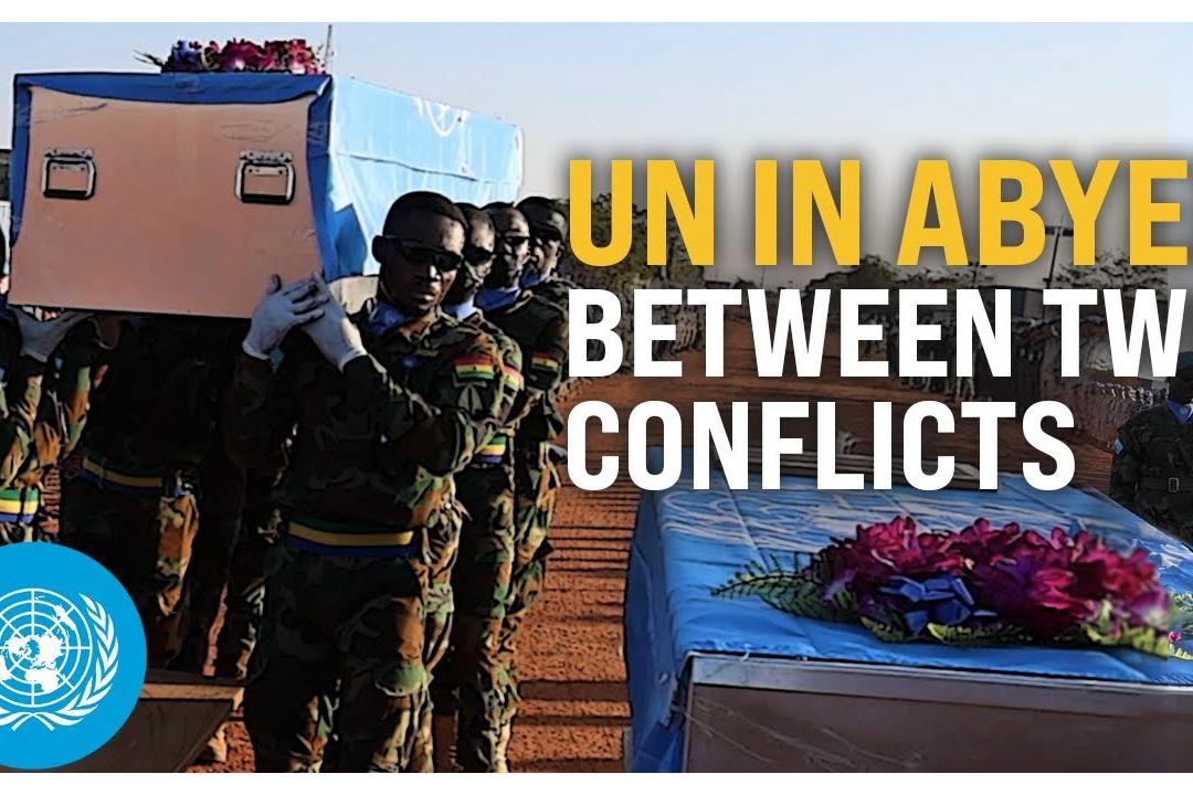 Peacekeepers carrying a coffin.