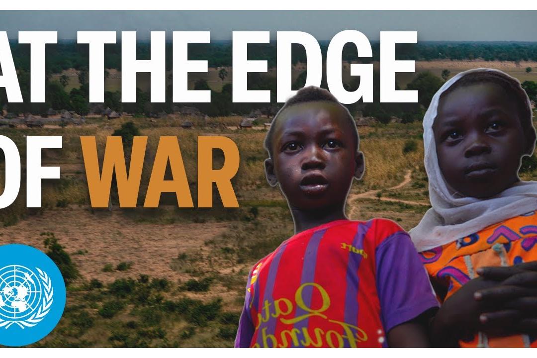 A boy and a girl staring at camera.